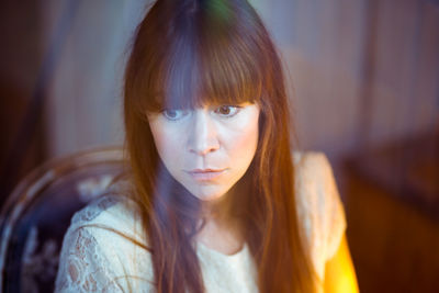 Close-up of young woman at home