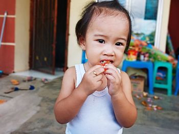 Portrait of cute boy eating