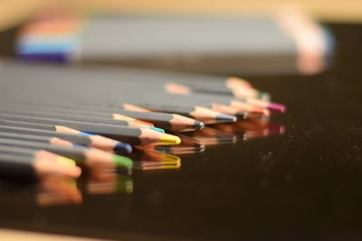 Close-up of colored pencils on table 