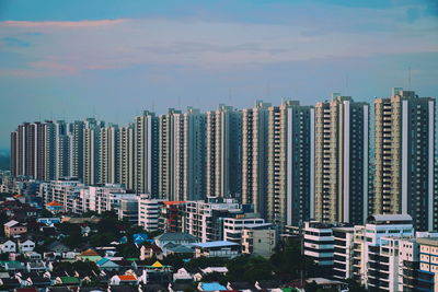 Modern buildings in city against sky