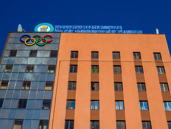 Low angle view of building against blue sky