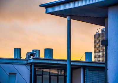 Low angle view of building against sky during sunset