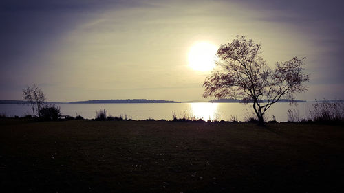 Scenic view of lake against sky during sunset