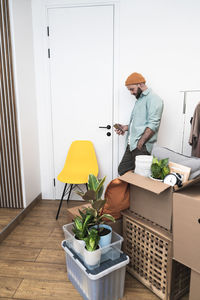 Adult man moving in new unfurnished apartments