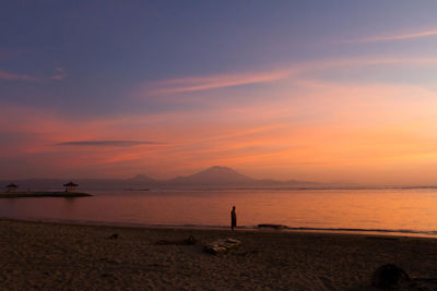 Man watching sunrise at the beach