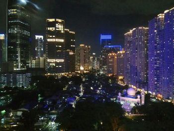 High angle view of illuminated buildings at night