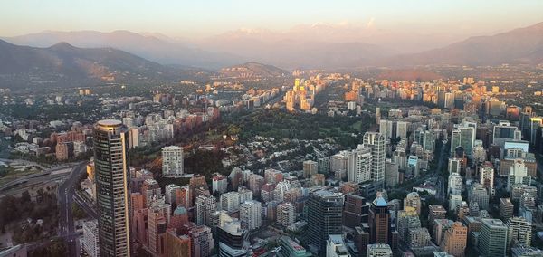 High angle view of city against sky during sunset