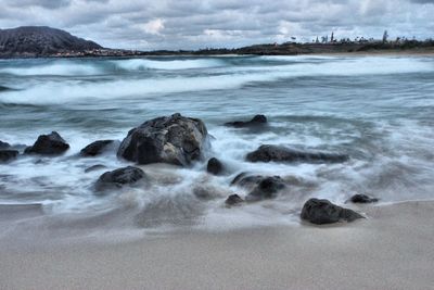 Scenic view of sea against cloudy sky
