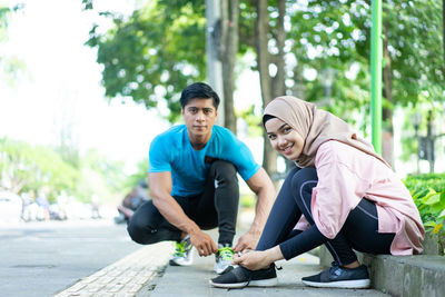 Portrait of smiling young couple outdoors