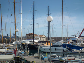 Boats moored at harbor