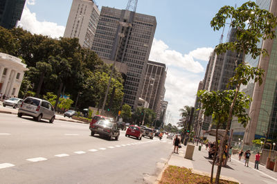 City street and buildings against sky