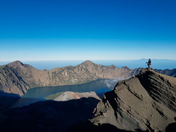 Scenic view of mountains against clear blue sky