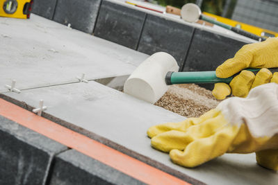 Cropped hand of person cleaning equipment