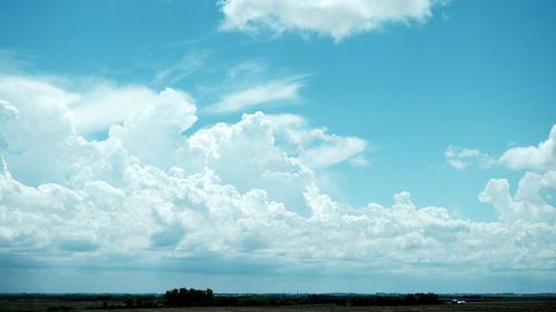 Scenic view of landscape against cloudy sky