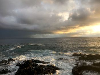 Scenic view of sea against cloudy sky