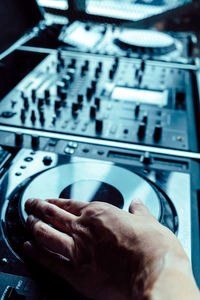 Close-up of man playing turntable