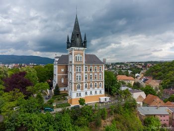 High angle view of trees and buildings against sky