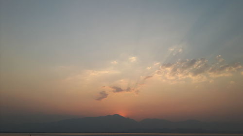 Low angle view of silhouette mountain against sky during sunset