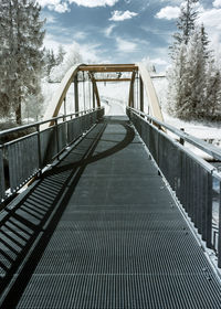 Mystical summer landscape with a bridge, infrared photography