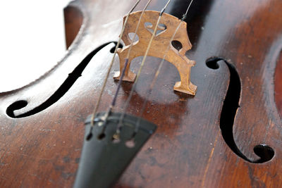 Close-up of guitar on wood