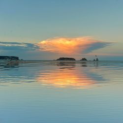 Scenic view of sea against sky at sunset