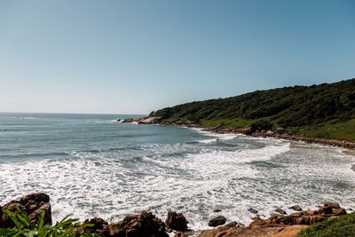 Scenic view of sea against clear blue sky