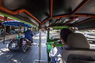 Rear view of people sitting in bus
