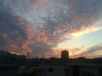 Cityscape against sky during sunset