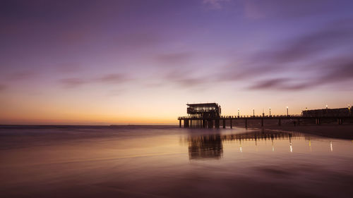 Scenic view of sea against sky at sunset