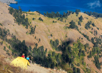 High angle view of tourists camping on mountain