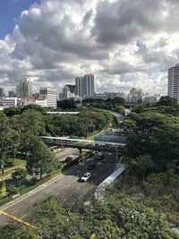 High angle view of street amidst buildings against sky