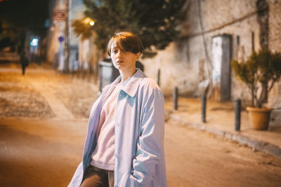 Woman standing on street in city