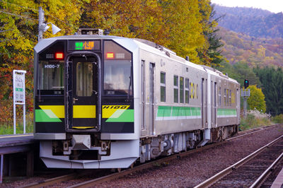 Autumn leaves and local train at the ginzan station