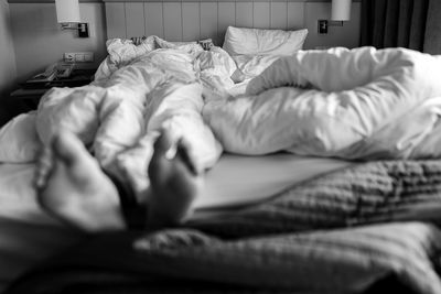 High angle view of baby sleeping on bed