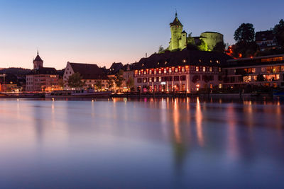 Illuminated buildings at waterfront