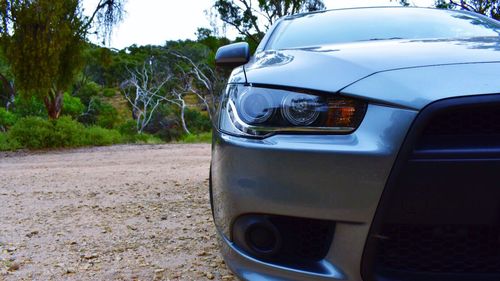 Close-up of car against sky