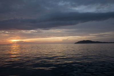 Scenic view of sea against cloudy sky