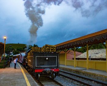 Train on railroad tracks against sky