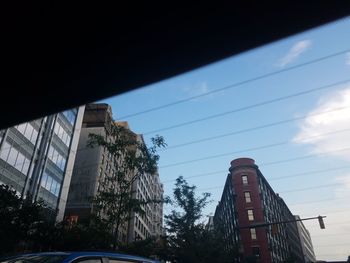 Low angle view of buildings against blue sky