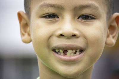 Close-up portrait of smiling boy