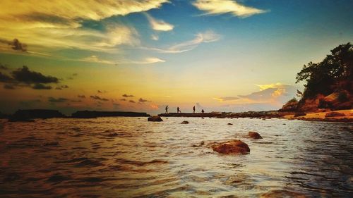 Scenic view of sea at sunset