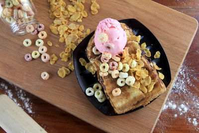 High angle view of chopped bread on cutting board