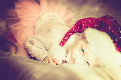 Close-up of baby sleeping on bed