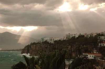 Panoramic view of townscape by sea against sky