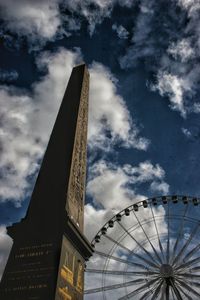 Low angle view of building against cloudy sky