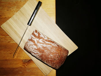 High angle view of bread on cutting board