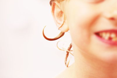 Portrait of woman against white background