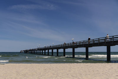 Pier on sea against sky