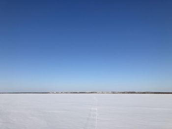 Scenic view of sea against clear blue sky