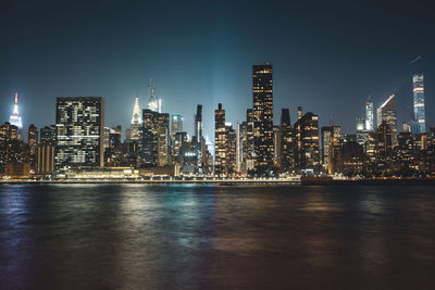 Illuminated buildings in city at night